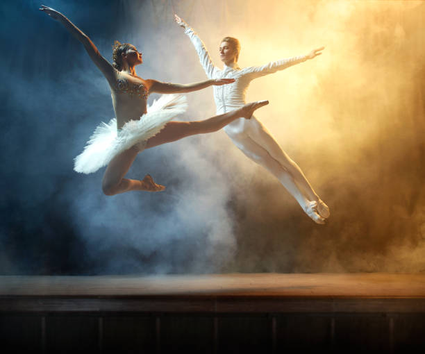 istock Ballet dancers performing on stage in theatre 644217144
