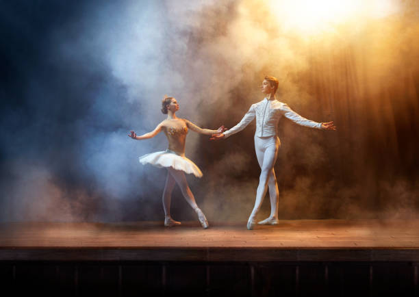istock Ballet dancers performing on stage in theatre 644217148
