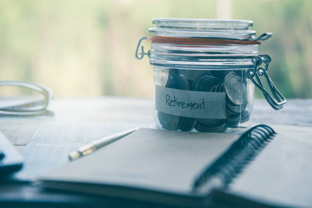 istock Retirement money in a jar and  saving account passbook 644217898