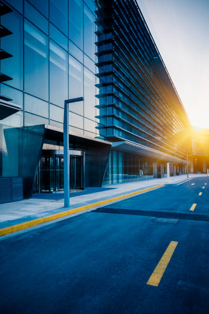 istock empty asphalt road along modern business buildings 644221060