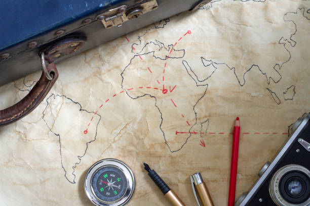 istock Travel plan abstract concept with old maps suitcase and camera 644228084