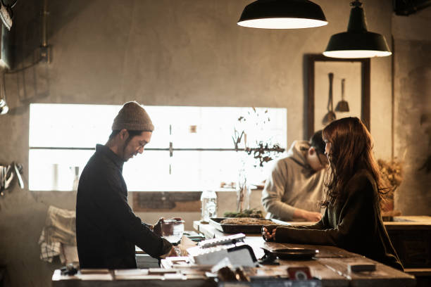 istock Two male cafe owners preparing coffee in coffee shop 644228156