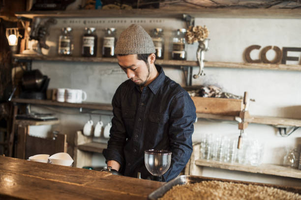 istock Male barista working in coffee shop 644228652