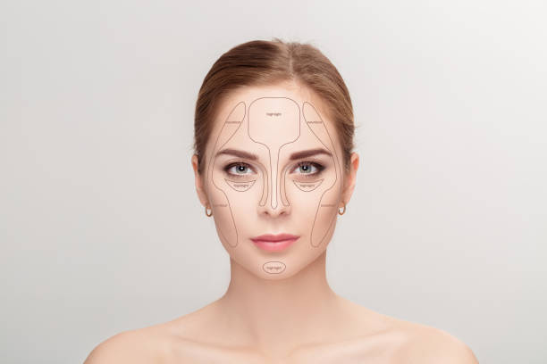 istock Contouring. Make up woman face on grey background.  Professional 644228784