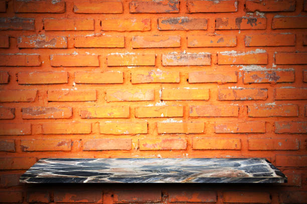 istock Empty top of natural stone shelves and stone wall background. 644231052