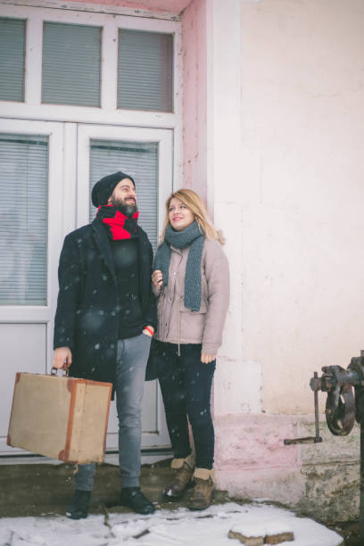 istock Young old-fashioned couple waiting for the train. 644231096