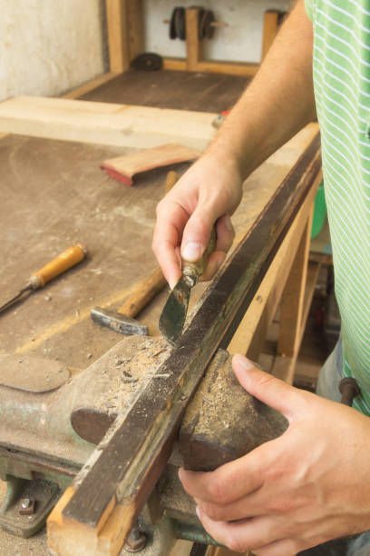 istock Carpenter working in his small 