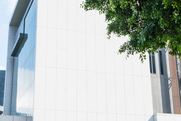 istock green leaves front of office building 644237088
