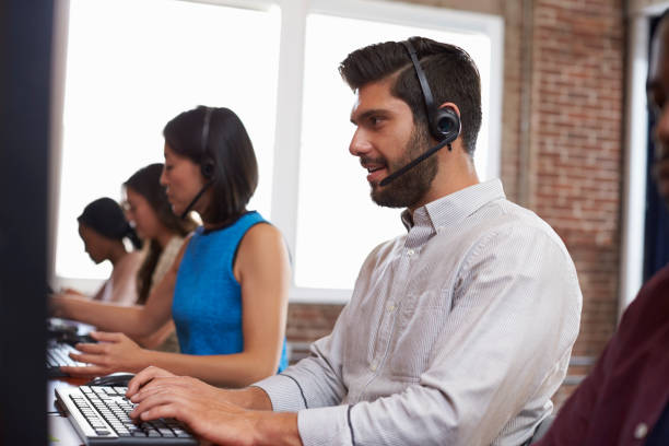 istock Staff Working In Busy Customer Service Department Shot 644244568
