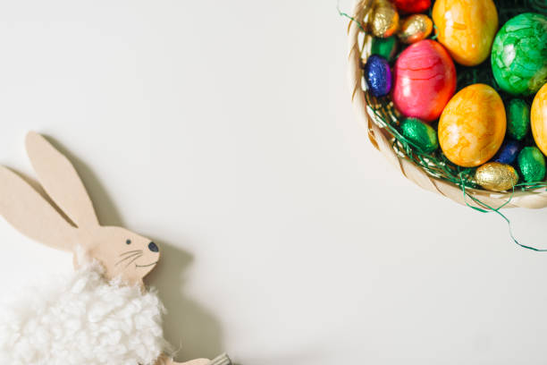 istock colored eggs in basket and a bunny in a corner 644260688