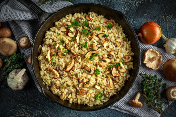 istock Mushroom Risotto in iron pan with herbs and parmesan cheese 644268914