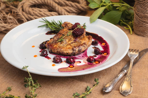 istock Pork steak on the bone with cherry-ginger sauce 644269058