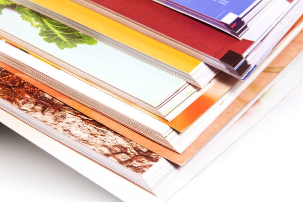 stack of colorful magazines stock photo