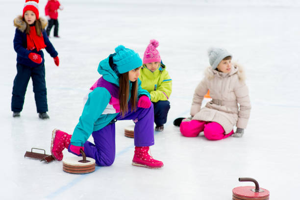 istock Young girls playing curling 644276002
