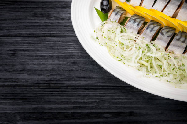 istock Herring fillets with onion and lemon slices 644281996