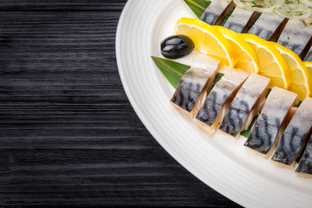 istock Herring fillets with onion and lemon slices 644282010