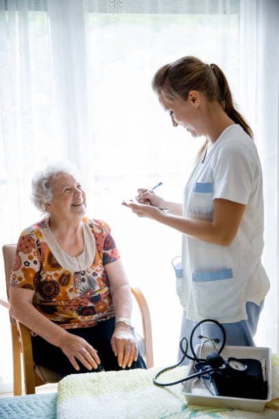istock Nurse Visiting Senior Woman For Check Up 644282416