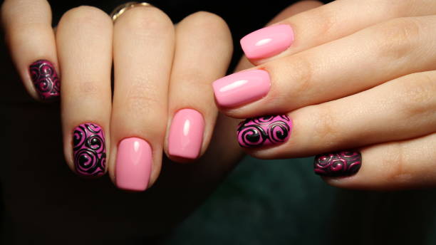 istock Candy manicure design, black monogram on pink 644283134