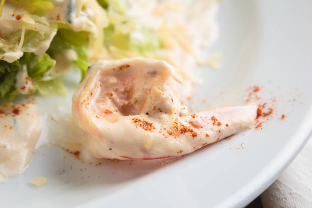istock Salad with tiger prawns, parmesan and cream 644283200