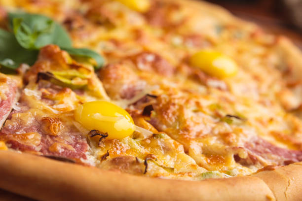 istock Pizza carbonara on a wooden vintage table 644286882