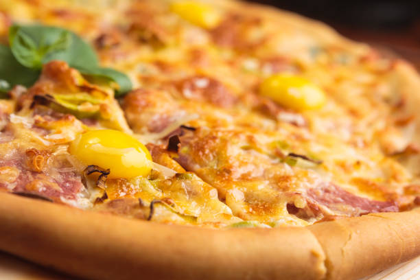istock Pizza carbonara on a wooden vintage table 644287072