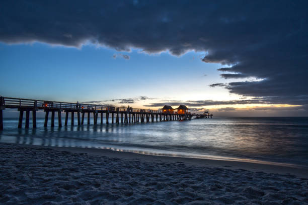 istock Dark Clouds over Naples Pier in Florida 644288046
