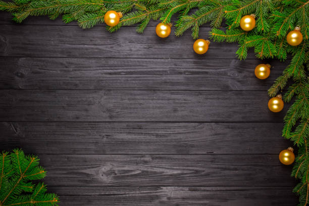 istock Christmas fir tree on black wooden background 644292390