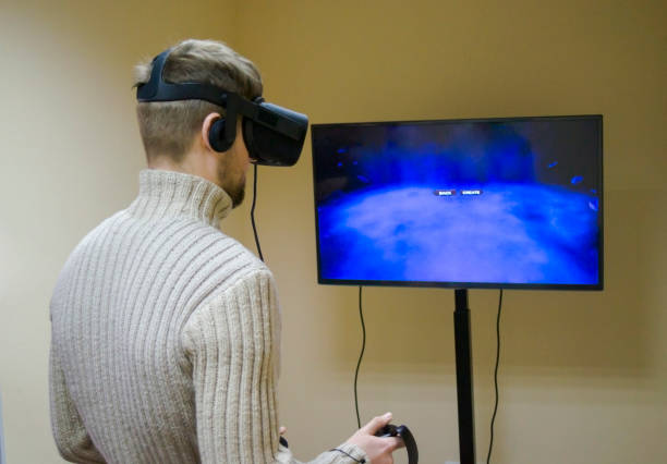 istock man in a helmet virtual reality plays a game 644303492