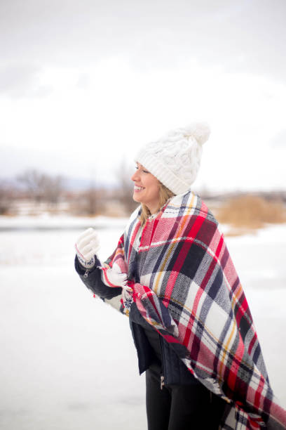 istock Young woman with white wool cap 644310420