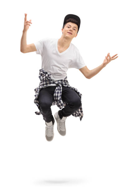 Red haired boy jumps in the air with a kick and a punch.