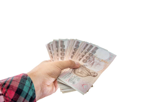 istock hand holding money isolated on white background 644324960