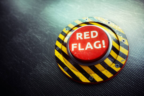 Red Flag Warning Button Concept A 3D render of a conceptual mechanism with a red button and the words "RED FLAG" written on it, placed on an dark industry grid. The image can represent various concepts of danger, from political, military.. to dangers in realtionships - the so called "red flag" metaphor. red flags stock pictures, royalty-free photos & images