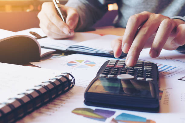 istock Close up hand man doing finance and calculate on desk 644354656