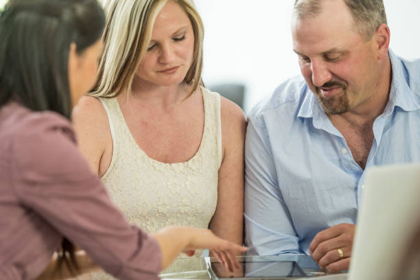 istock Financial Advisor Meeting with a Couple 644362178