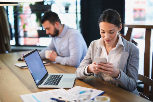 istock Businesswoman using mobile phone in the office 644366858