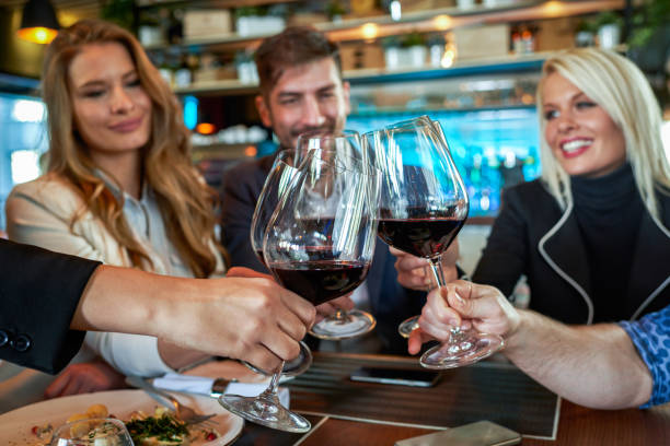 istock People celebrating in the restaurant 644366992