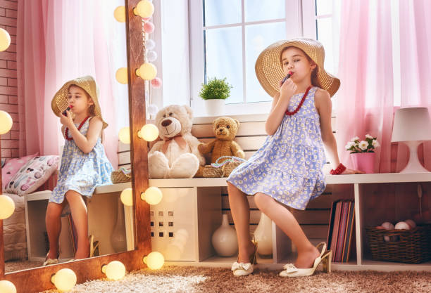 istock girl dresses up at home 644371952