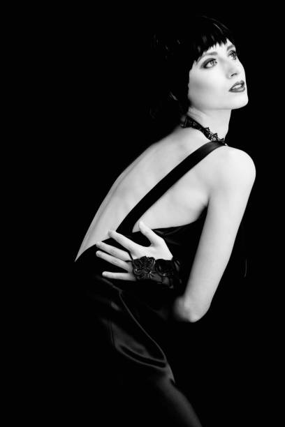 female drub portrait against black background (Gloria Swanson impersonation)