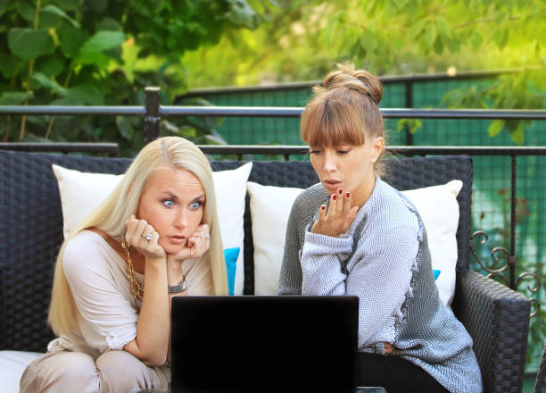 istock Two middle-aged women sitting in a cafe 644376070