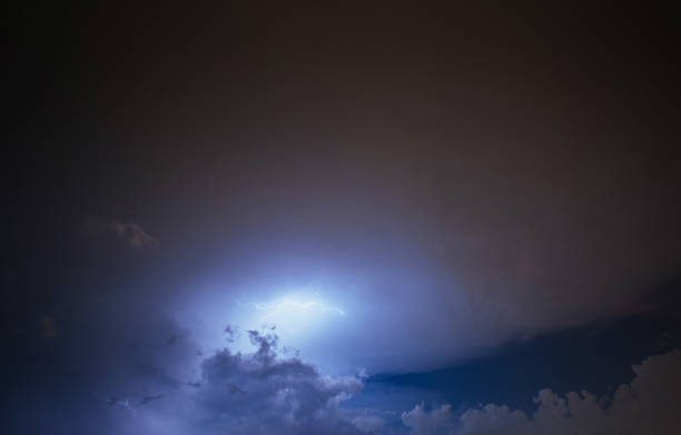 istock Lightning strike on the cloudy dark sky. Fantastic summer night 644376648