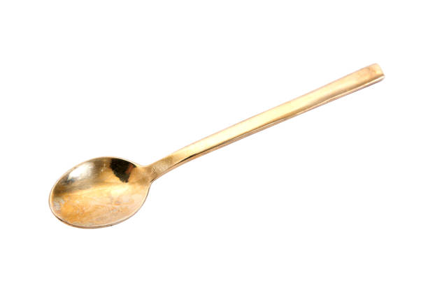 Brass spoon isolated on white background.Brass teaspoon isolated.Brass tea spoon