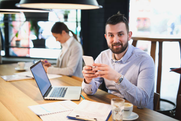 istock Businessman using mobile phone in the office 644401804