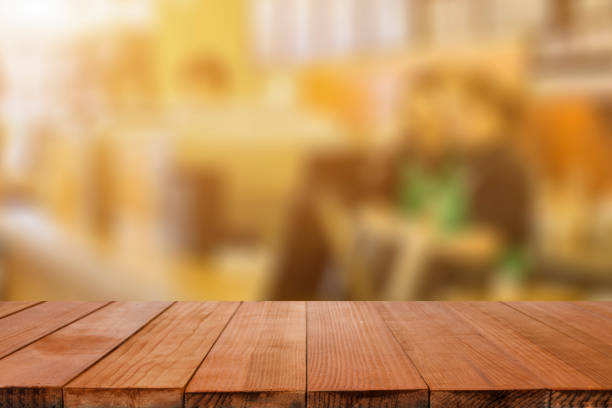 istock Empty brown wooden table and Coffee shop 644404924
