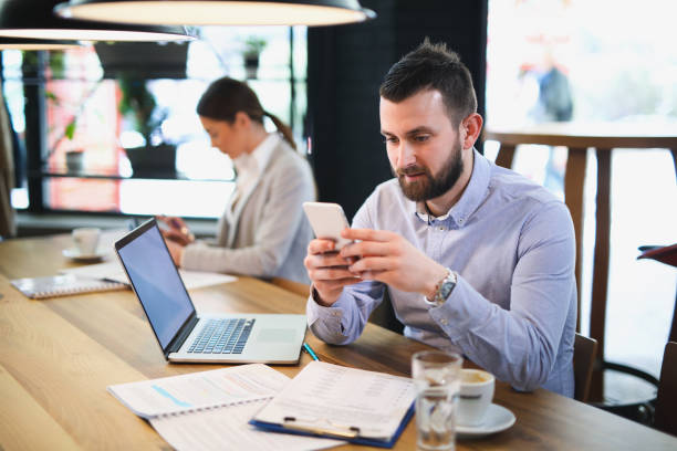 istock Businessman using mobile phone in the office 644405094