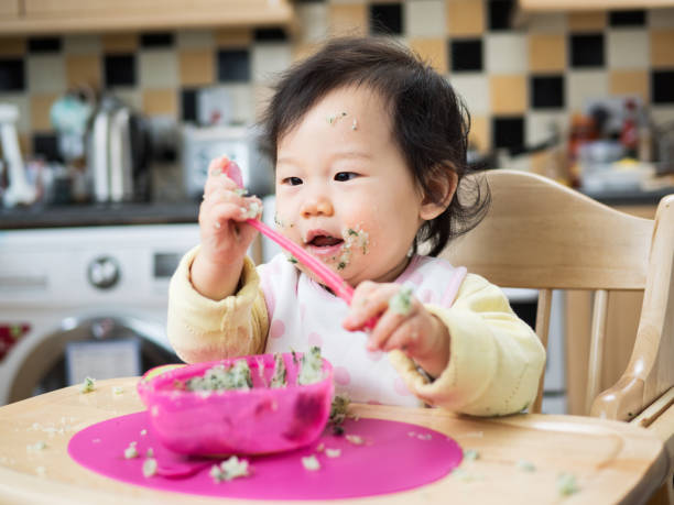 istock eating mess baby girl 644417780