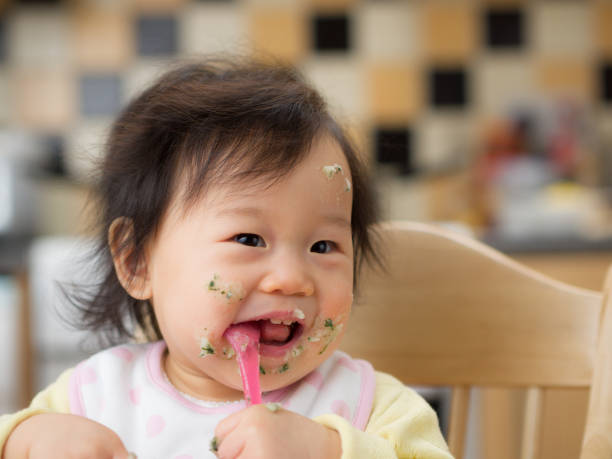 istock eating mess baby girl 644418268