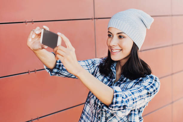 istock Young woman taking a selfie 644418614