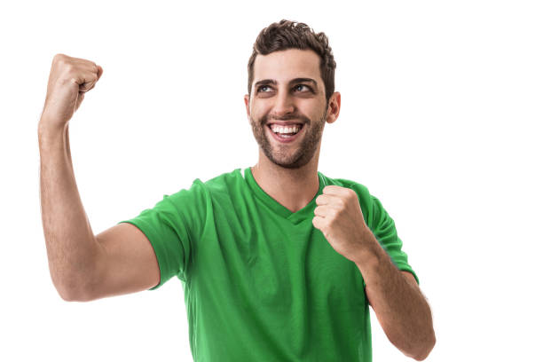 istock Fan / Sport Player on green uniform celebrating on white background 644425606
