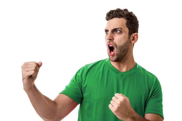 istock Fan / Sport Player on green uniform celebrating on white background 644425704