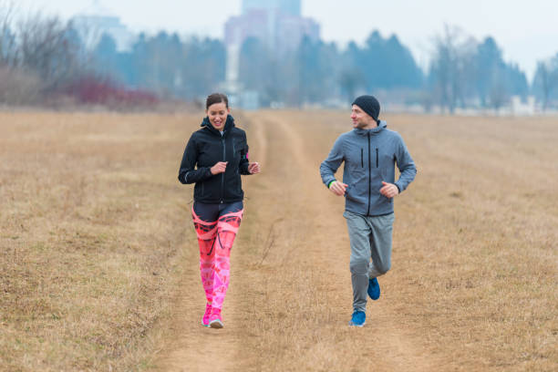 istock Young couple running together 644425780